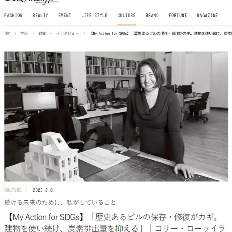 a woman is standing in front of a desk